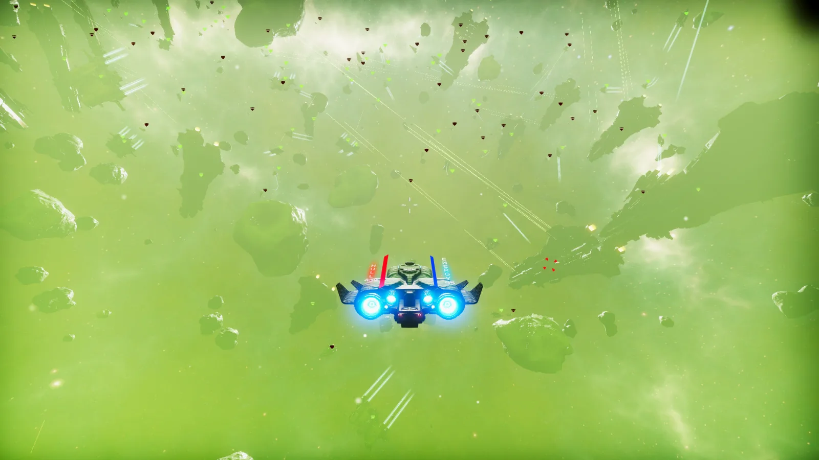 A mercenary spacecraft faces capital ships in a green nebula in Space Mercs.